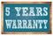 5 YEARS WARRANTY words on blue wooden frame school blackboard