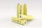 5 yellow cylindrical lithium-ion batteries type 18650 on a light gray background. Rechargeable batteries for electrical