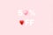 50 percent off sale banner. Heart shaped candies on pink background.