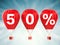 50% sale sign on red hot air balloons