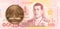 50 thai satang coin against 100 new thai baht banknote