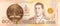 50 thai satang coin against 1000 new thai baht banknote
