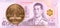 50 thai satang coin against 500 new thai baht banknote