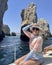 50 year-old Caucasian female tourist on a sailboat tour from Cabo San Lucas.