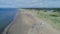 50fps aerial Couple with dog on Outdoor vacation caravan campsite camper on Melby beach, Sweden by the ocean