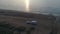 50fps aerial Sunset Couple with dog on Outdoor vacation caravan campsite camper on Melby beach, Sweden by the ocean