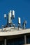 5G and 4G mobile phone antennas installed on the rooftop of a building