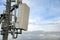 5G new radio telecommunication network antenna mounted on a metal pole providing strong signal waves