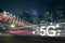 5G symbol is speeding on the road at night