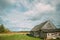 5k Timelapse Summer Colorful Dramatic Sky With Cumulus Clouds Above Old Village Building. Beautiful Rural Landscape