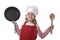 6 or 7 years old little girl in cooking hat and red apron playing cook smiling happy holding pan and spoon