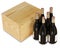 6 bottles of red wine bottles next to a closed wooden box isolated on white background