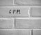 6 P.M. WRITTEN ON WHITE PLAIN BRICK WALL