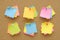 6 set colorful of sticky notes push pins on cork board