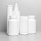 6 white vials without labels for medicines, vitamins, sprays, liquids are on a gray shelf