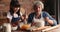 60s elderly woman teach little granddaughter to cook