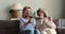 60s woman her older mother talking sitting on sofa with teacups