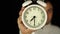 7:30 o`clock. Human hand holding alarm clock that showing seven-thirty o`clock and ringing.