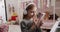 The 7-year-old girl in the children's room with headphones and using smartphone.