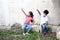 7 year old Latino boy and 5 year old girl with face masks playing