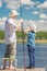 7-year-old son helps his father to fish