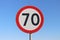 70 km/h speed limit road sign with a blue sky background