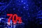 70 percent discount with blue bokeh background. Discounts in the shopping center. Seasonal sale, black friday. Red label