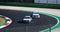 70s vintage touring BMW cars racing in asphalt circuit turn racetrack