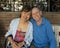 76 year-old Caucasian husband and his 65 year-old Korean wife relaxing before breakfast in Cabo San Lucas.