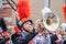 8-28-2019 Tahlequah USA - Young man in uniform enthusiastically plays the trombone in a high school marching band parade with