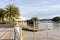 8 3 2023 trees, boat and building along Sungai Kedayan river, the capital of Brunei Darussalam in sunny day with white coulds and