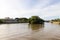 8 3 2023 trees, boat and building along Sungai Kedayan river, the capital of Brunei Darussalam in sunny day with white coulds and