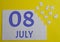 8 july calendar date on a white puzzle with separate details. Puzzle on a yellow background with a blue inscription