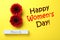 8 March greeting card design with red gerberas on yellow background, flat lay. Happy Women`s day