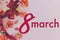 8 march text sign and stylish gift box with flowers on pink background. Greeting card. Happy women\\\'s day and