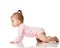 8 month infant child baby girl toddler learning how to crawl in pink shirt looking at corner