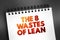 The 8 Wastes of Lean text concept on notepad for presentations and reports