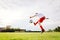 8 years old boy child kicking ball on playing field.