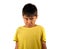 8 years old male child sad and ashamed after suffering reprimand isolated on white background wearing yellow t-shirt in emotional