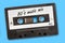 80`s music mix written on vintage audio cassette tape, blue background