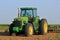 8300 John Deere tractor in a farm field ready for work