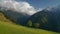 8K Green Meadow Covered With Yellow Flowers in Gorgeous Snowy Mountains