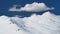 8K White Cumulus Cloud in Blue Sky on Treeless Snowy Hill