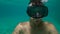 8x times slowmotion shot of a man in adiving mask training breath holding in a pool