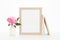 8x10 gold frame mockup on a white backlit background. Pink Peony in white vase, neutral books