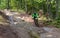 On 9/2/2017 in Copper Harbor, Michigan mountain biker riding on wet slick rock during enduro race