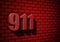 911 emergency number on dark wall