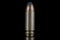 9mm caliber round with reflexion on black with reflexion