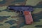 9mm russian handgun on russian camouflage uniform