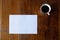 A4 mockup top view with cup of coffee on wooden table vertical horizontal